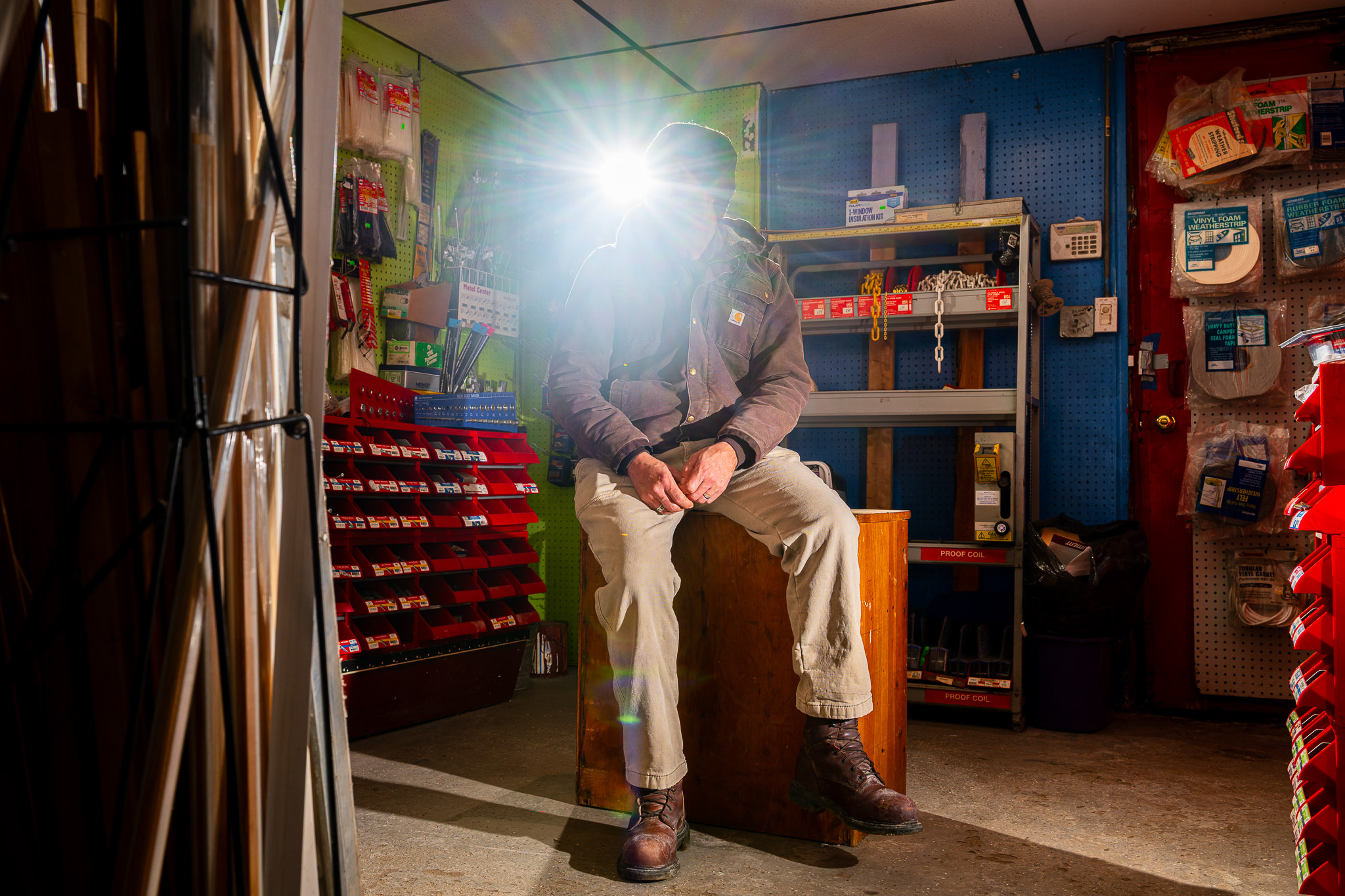 Alejandro, a Detroit construction worker, sits in a hardware store in February 2026.